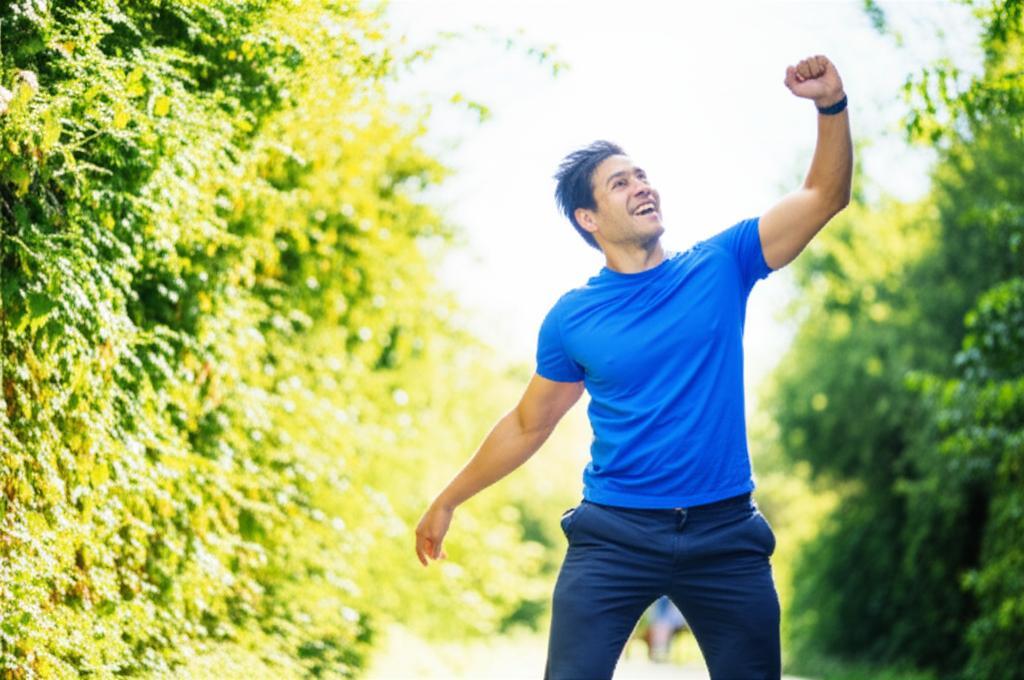 A man looking energetic and confident, perhaps exercising outdoors or engaged in a hobby, representing renewed vitality, dynamic pose.
